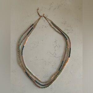 Gold Tone Triple Strand Necklace with Glass Faceted Beads